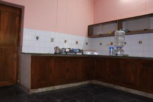 a kitchen with a counter and a sink in it at Feel Like Home in Visakhapatnam