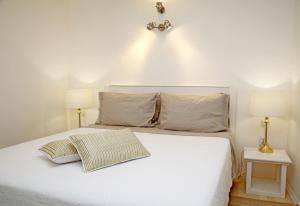 מיטה או מיטות בחדר ב-Swan City Apartment & Room