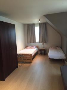 Postel nebo postele na pokoji v ubytování Hotel Prélude