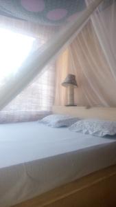 Posteľ alebo postele v izbe v ubytovaní Wildebeeste Lamu