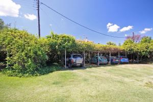 a group of cars parked in a parking lot at Villa Angela in Vourvourou