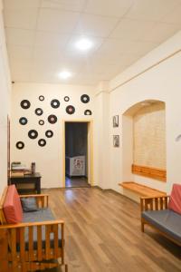 a living room filled with furniture and a large window at Vishnya Hostel in Dnipro