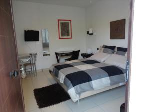 Postel nebo postele na pokoji v ubytování B&B Terra Marique