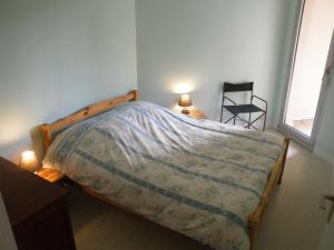Tempat tidur dalam kamar di Appartement T3 - 4 personnes - Face Océan - Thalasso