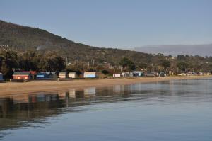 a large body of water with a beach at Kangerong Holiday Park in Dromana