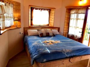 Кровать или кровати в номере Baita Chalet Alabama
