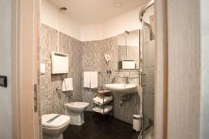 a bathroom with a toilet and a sink at Hotel Milano Navigli in Milan