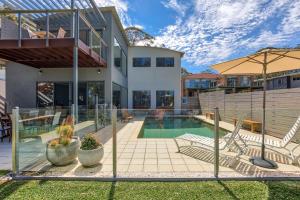 an image of a house with a swimming pool at The Edgewater on Greville in Sanctuary Point