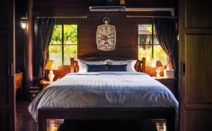 Postel nebo postele na pokoji v ubytování Rommai Villa Chiang Rai