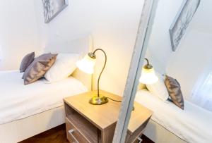 Postel nebo postele na pokoji v ubytování Urban Luxury Suites Juricevic