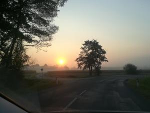 The sunrise or sunset as seen from a vendégházakat or nearby