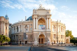a large building with a picture on the front of it at Alex Hotel in Odesa