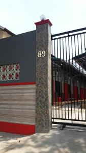 a building with a clock on the side of it at Homestay dan Kost 78 in Jepara