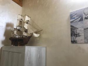 a model of a pirate ship on a wall at B&B Le Mansarde in Pescara