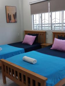 Postel nebo postele na pokoji v ubytování Long Hostel
