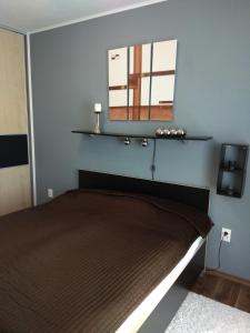 A bed or beds in a room at Apartmán Terchová