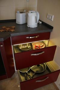 a kitchen with a counter top with a microwave at Posthotel in Bad Bertrich