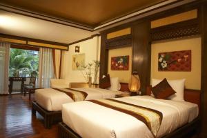 Ein Bett oder Betten in einem Zimmer der Unterkunft Salad Buri Resort- SHA Extra Plus