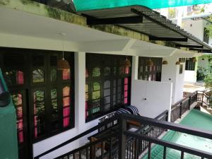 a porch of a house with a swimming pool at Villa Eden Paradise in Ella