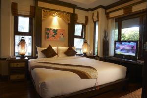 Ein Bett oder Betten in einem Zimmer der Unterkunft Salad Buri Resort- SHA Extra Plus