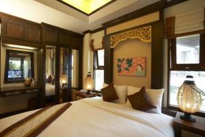 Ein Bett oder Betten in einem Zimmer der Unterkunft Salad Buri Resort- SHA Extra Plus