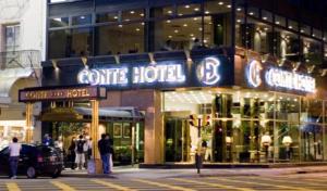 a store with a sign for a corner hotel at Hotel Conte in Buenos Aires