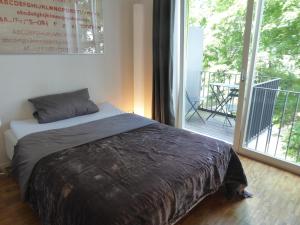 Кровать или кровати в номере Apartments Am Friedrichshain