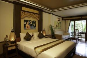 Ein Bett oder Betten in einem Zimmer der Unterkunft Salad Buri Resort- SHA Extra Plus