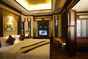 Ein Bett oder Betten in einem Zimmer der Unterkunft Salad Buri Resort- SHA Extra Plus