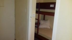 a bedroom with a bunk bed in a room at N101, parc d'arradoy-St J P de Port in Uhart-Cize