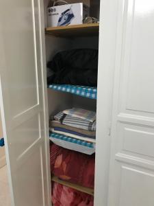 a closet filled with lots of folded towels at Apartment Tunis 1 Near airport in Ariana