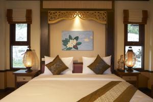Ein Bett oder Betten in einem Zimmer der Unterkunft Salad Buri Resort- SHA Extra Plus