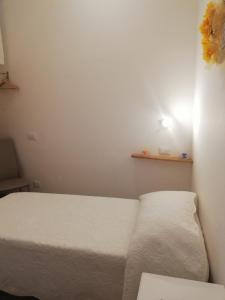 A bed or beds in a room at Il lago del Mugello B&B