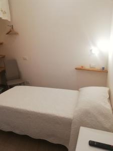 A bed or beds in a room at Il lago del Mugello B&B