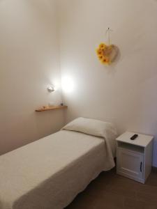 A bed or beds in a room at Il lago del Mugello B&B