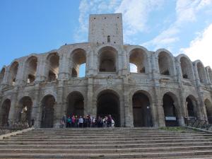 a group of people standing in front of a building at Arles Bienvenue in Arles