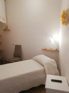 A bed or beds in a room at Il lago del Mugello B&B