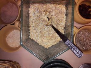 a glass container filled with oats and a spoon at Pension Behnisch in Strehla