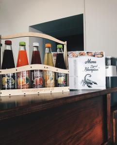 a bunch of bottles of soda sitting on a counter at Zajazd Skorpion Rzeniszów in Koziegłowy