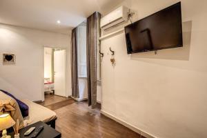 TV a/nebo společenská místnost v ubytování Guest House o Affittacamere La Civetta di Trastevere B