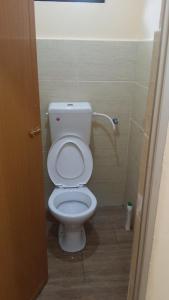 a bathroom with a white toilet in a stall at IsMa Lumut Homestay in Lumut +8 photos