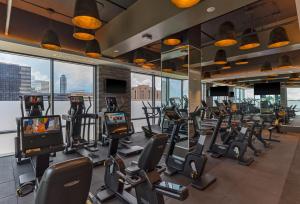 a gym with treadmills and exercise equipment in a building at The Post Oak Hotel in Houston