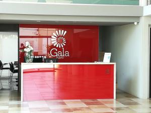 a store with a red counter with a cala sign on it at Gala Puerto Apartamento 108 in Punta del Este