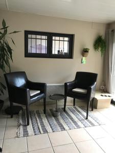 Posezení v ubytování Appartement Sevrier terrasse et jardin