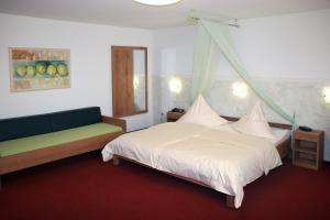 Postel nebo postele na pokoji v ubytování Hotel Flora