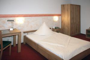 Postel nebo postele na pokoji v ubytování Hotel Flora