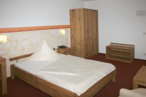 Postel nebo postele na pokoji v ubytování Hotel Flora