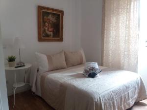 A bed or beds in a room at Casa de Huéspedes Prada