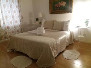 A bed or beds in a room at Casa de Huéspedes Prada