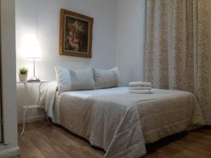 A bed or beds in a room at Casa de Huéspedes Prada